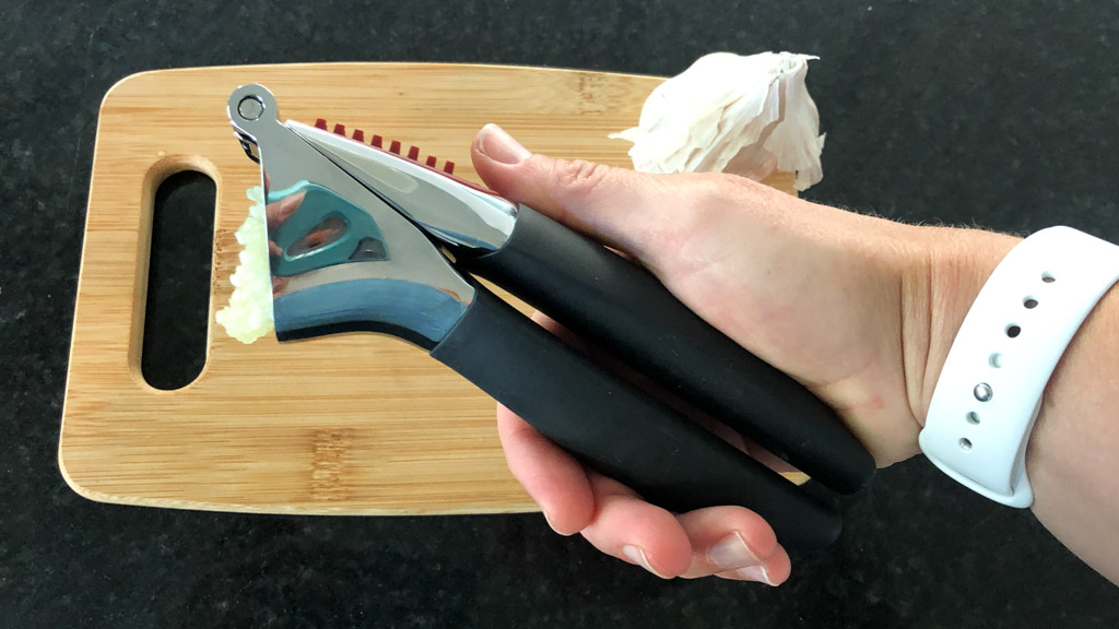 https://www.dontwasteyourmoney.com/wp-content/uploads/2020/06/garlic-press-for-kitchens-oxo-good-grips-soft-handled-crushed-review-ub-1.jpg