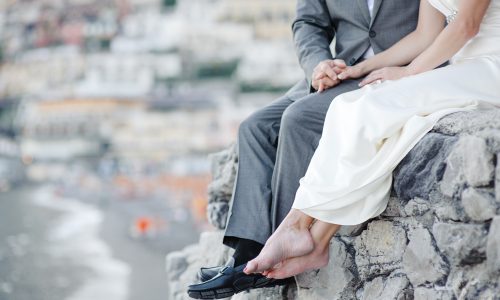 Bride and groom relaxing in wedding day in Positano, Amalfi coast