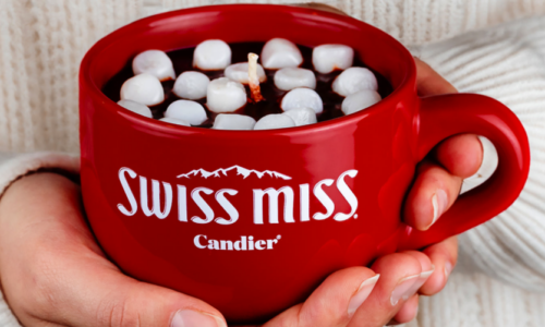 Hands hold Swiss Miss candle