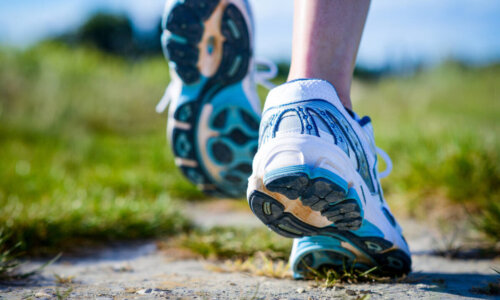 A person runs on an outdoor trail.