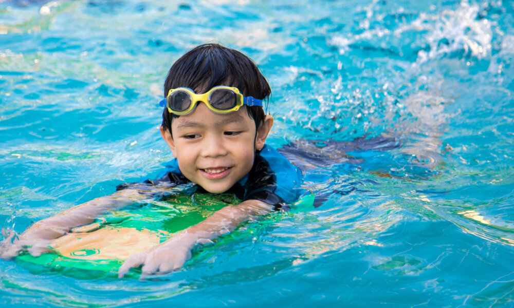 boy swimming in pool